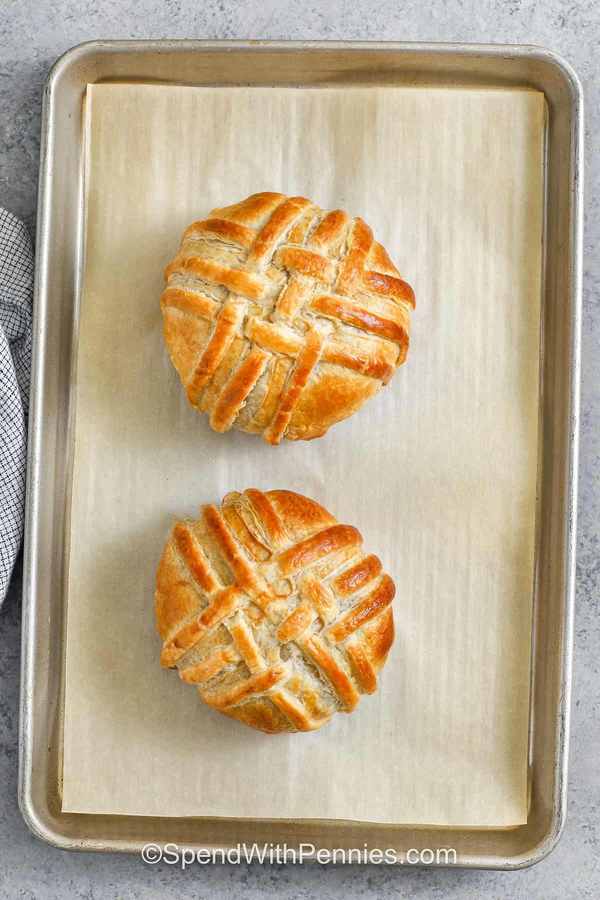 My favorite part of this Beef Wellington recipe? The way the mushrooms and prosciutto wrap around the steak locks in all the flavor. It bakes up golden and crisp, and every bite is full of rich, savory goodness. It’s elegant enough for a date night or celebration, but easy enough to make anytime you want to treat yourself to something special. You’ll want to make it again and again! #spendwithpennies baked Beef Wellington on a sheet pan