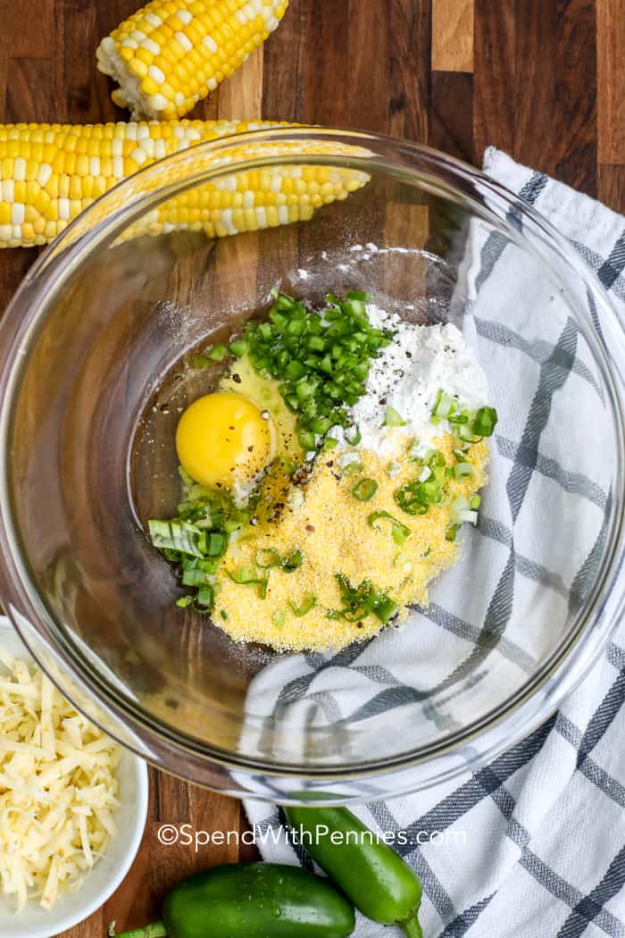 Corn fritters are one of those recipes that make any meal better. They’re easy to make with cornmeal, sweet corn, shredded Monterey jack cheese. Seasoned with jalapeno and smoked paprika, every bite is satisfying. Add shredded zucchini or potato to the batter for a boost of veggies. These crispy fritters are fried until golden and pair perfectly with beef or chicken. Try them with sour cream, hot sauce, or even maple syrup for a fun twist. simple, savory, and always a hit. #spendwithpennies Corn Fritters being prepared