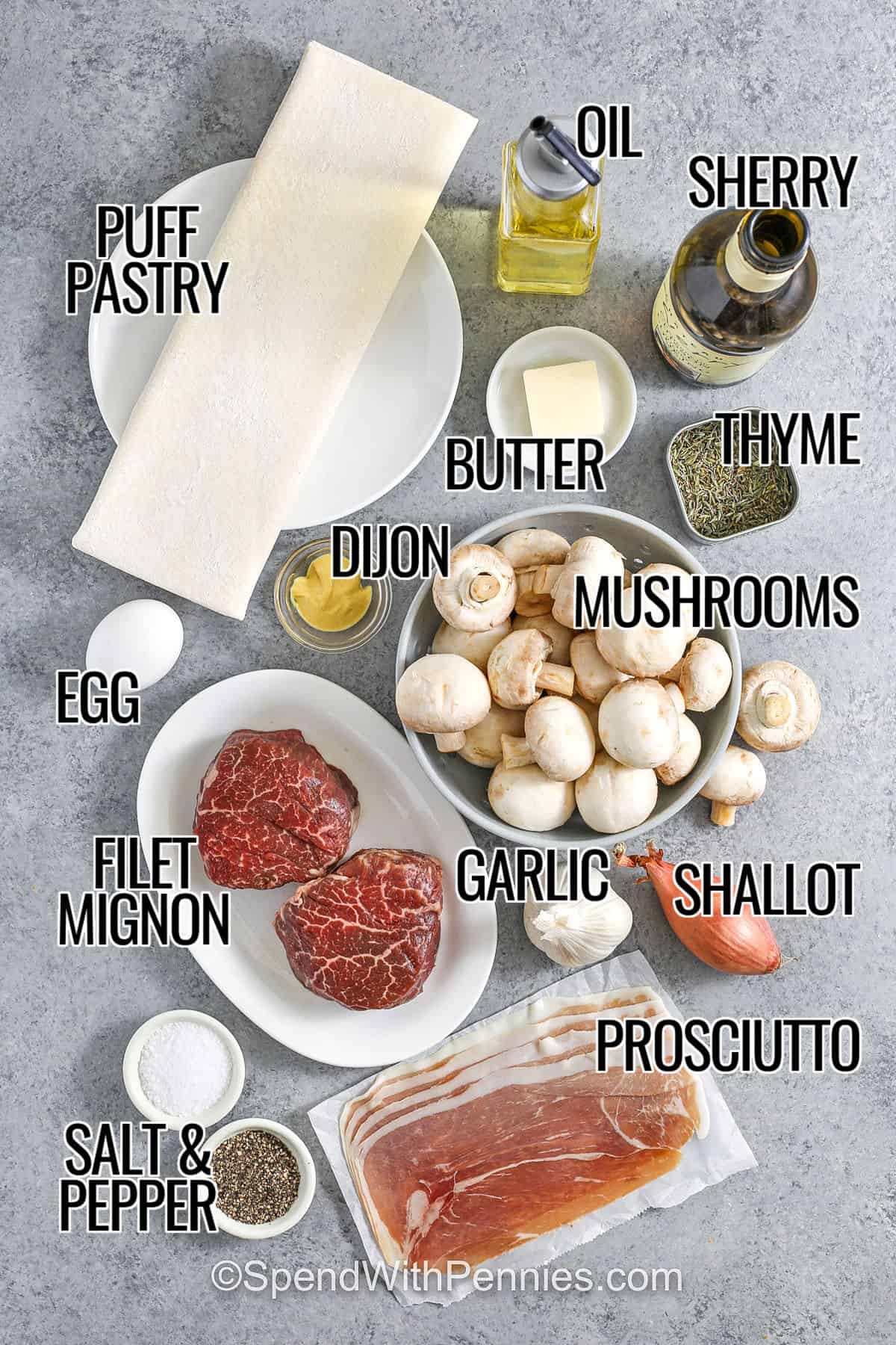 This Beef Wellington recipe brings a fancy restaurant classic right to your kitchen with simple ingredients and big flavor. The filet stays tender inside its golden pastry crust, and the mushroom mixture packs every bite with rich, savory goodness. Serve it with mashed potatoes or a side salad for a meal that’s as delicious as it is impressive. Trust me, this one’s a keeper! #spendwithpennies puff pastry , oil , sherry , butter , thyme , mushrooms , dijon , egg, garlic, shallot , filets mignon , prosciutto , salt and pepper