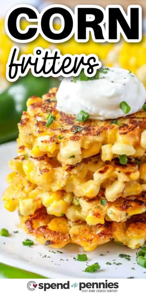 Corn fritters are one of those recipes that make any meal better. They’re easy to make with cornmeal, sweet corn, shredded Monterey jack cheese. Seasoned with jalapeno and smoked paprika, every bite is satisfying. Add shredded zucchini or potato to the batter for a boost of veggies. These crispy fritters are fried until golden and pair perfectly with beef or chicken. Try them with sour cream, hot sauce, or even maple syrup for a fun twist. simple, savory, and always a hit. #spendwithpennies stack of Corn Fritters with sour cream on top and a title
