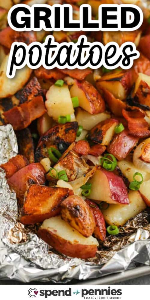 Grilled potatoes bring all the flavor with hardly any cleanup! Just season red potatoes with butter, garlic, rosemary, and onions, wrap them in foil, and let the grill do the work. They’re golden on the outside and soft on the inside, perfect with anything from grilled chicken to juicy burgers. So easy and so delicious! #spendwithpennies Grilled Potatoes with green onions and a title