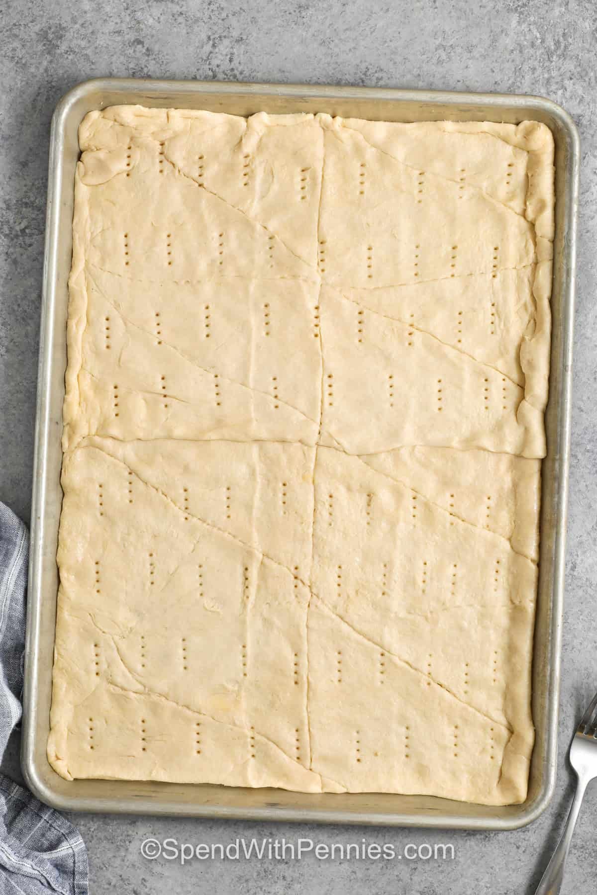 uncooked pizza crust in a pan