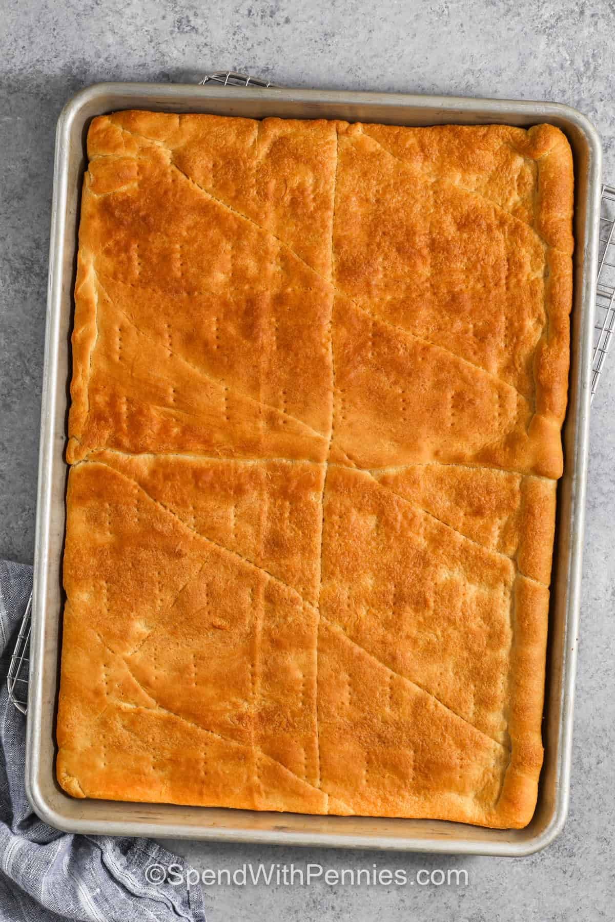Cooked veggie pizza crust in a pan