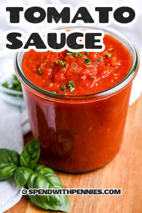 This tomato sauce is rich, savory, and full of fresh flavor thanks to whole canned tomatoes, garlic, and herbs. It’s gently simmered to bring out the natural sweetness of the tomatoes and finished with basil for a pop of color and taste. Perfect for pasta, pizza, or dipping, it’s a simple and delicious homemade staple. Customize the texture by blending it smooth or leaving it chunky! #spendwithpennies homemade Tomato Sauce in a jar with a title