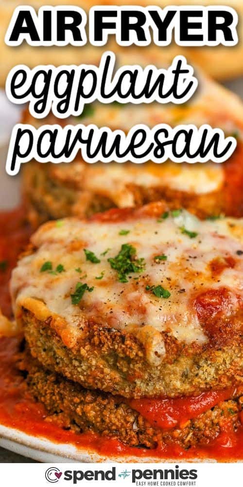 If you're looking for the best way to make eggplant parmesan, this air fryer eggplant parmesan recipe is it! The slices get breaded, then fried up in the air fryer until they’re golden and crispy. Top with sauce and cheese, and cook just until bubbly. Try it with chicken for a hearty version or go keto by skipping the breadcrumbs. It’s an easy weeknight favorite with all the comfort you love. #spendwithpennies close up of Air Fryer Eggplant Parmesan with writing